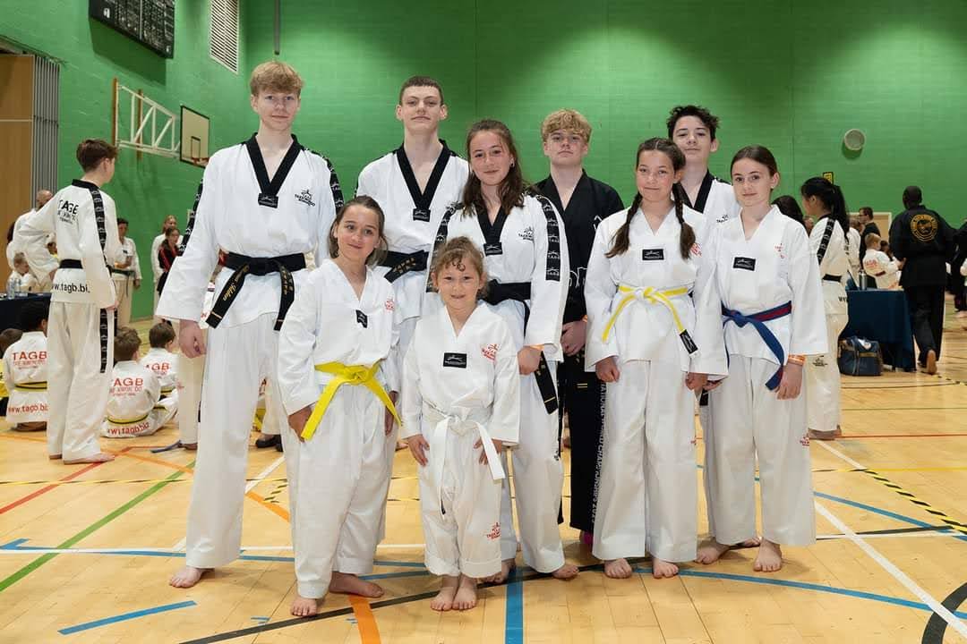 Aurora with teammates at a Taekwondo competition