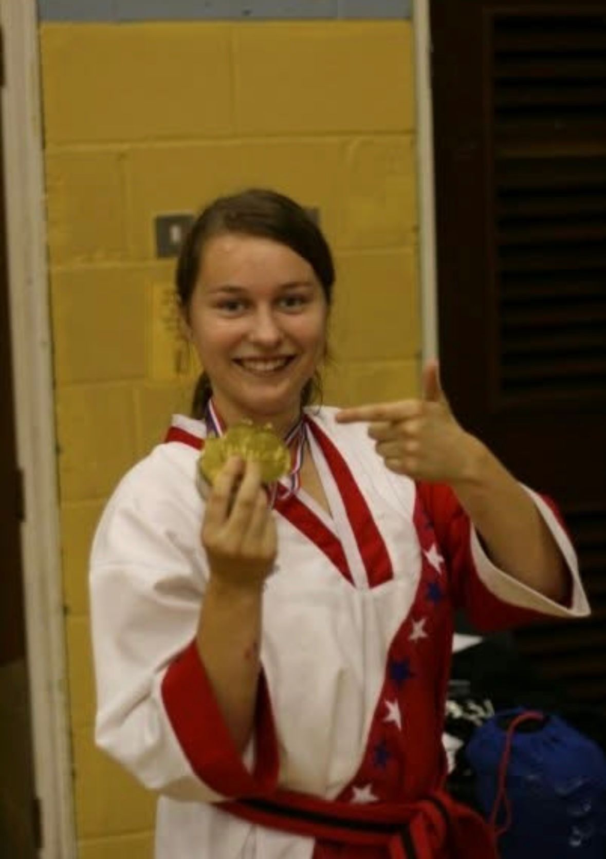 Ellen Simmons celebrating a gold medal win