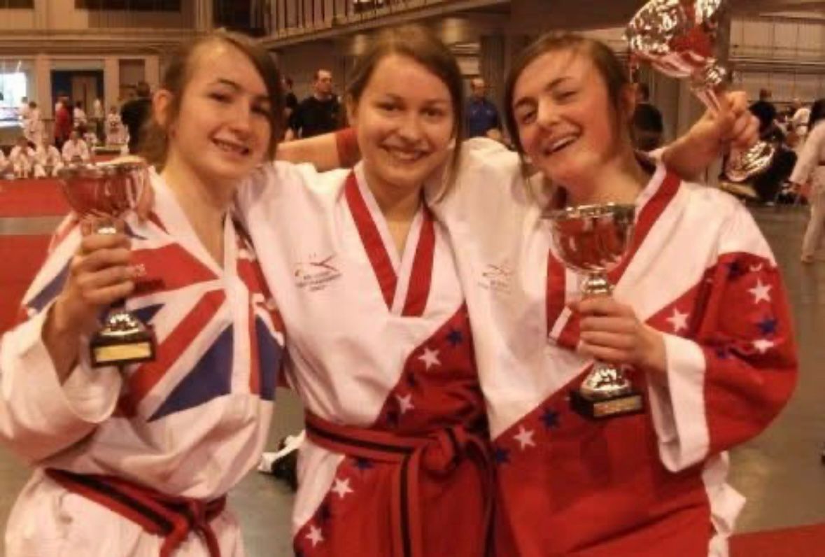 Ellen Simmons celebrating with trophies at international competition