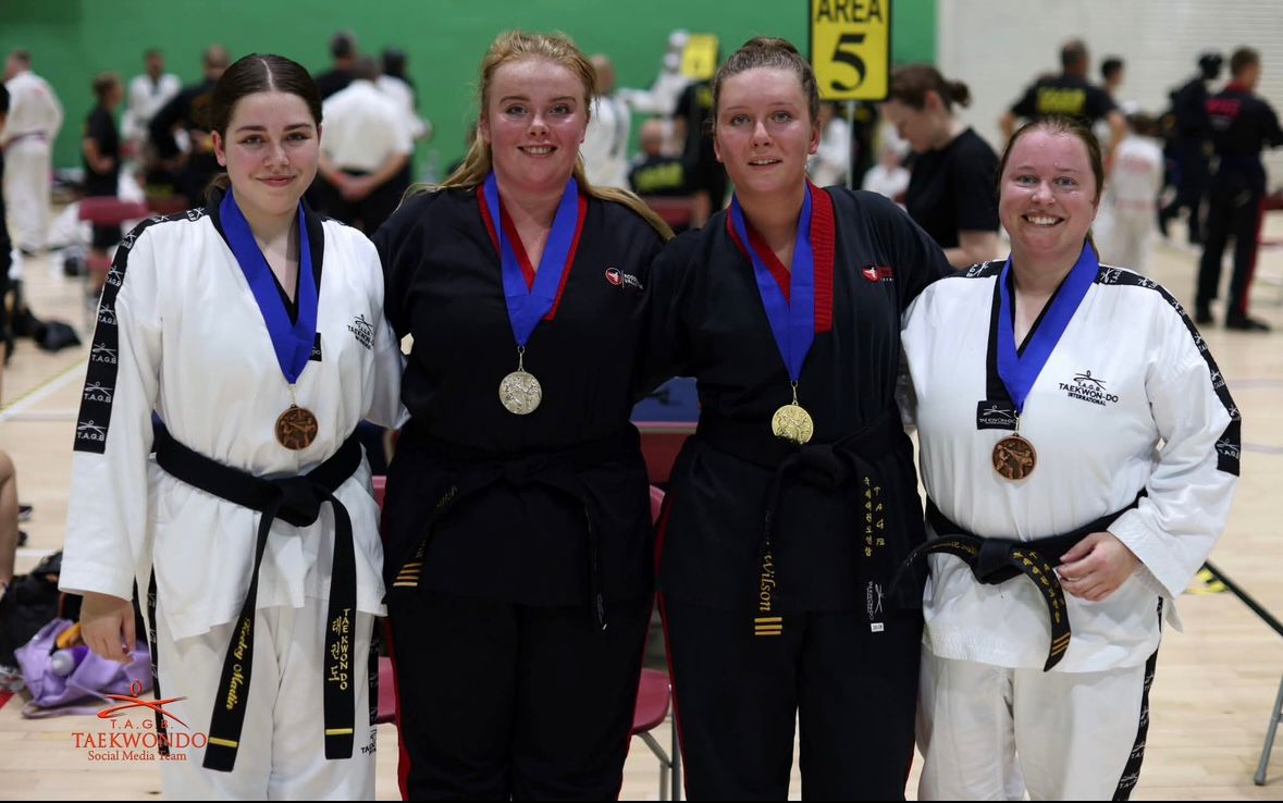 Ellen Simmons at TAGE International competition with medals