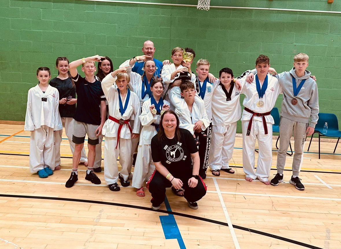 Ellen Simmons with students celebrating at competition