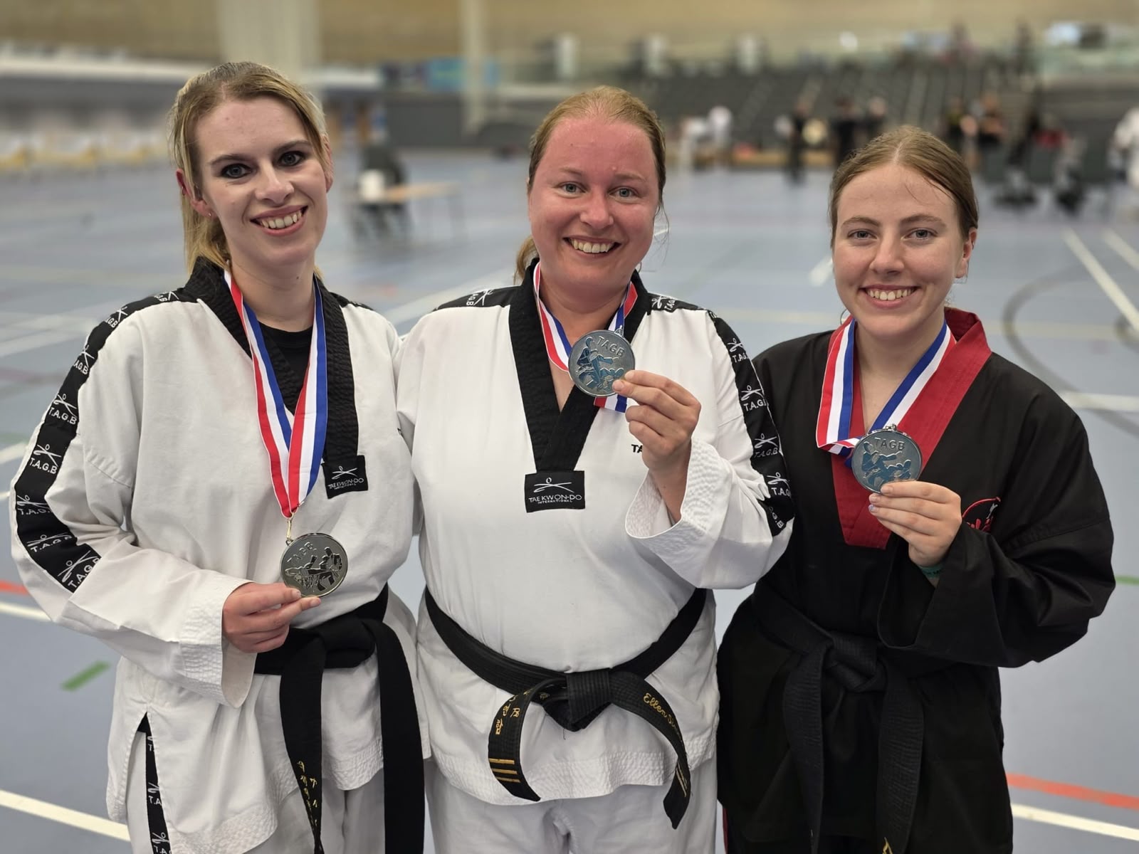 Ellen with fellow Taekwondo competitors and medals