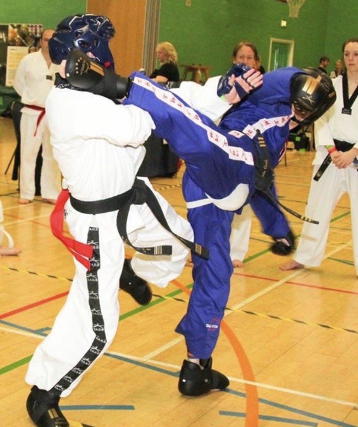 Gavin Cook landing a kick in competition