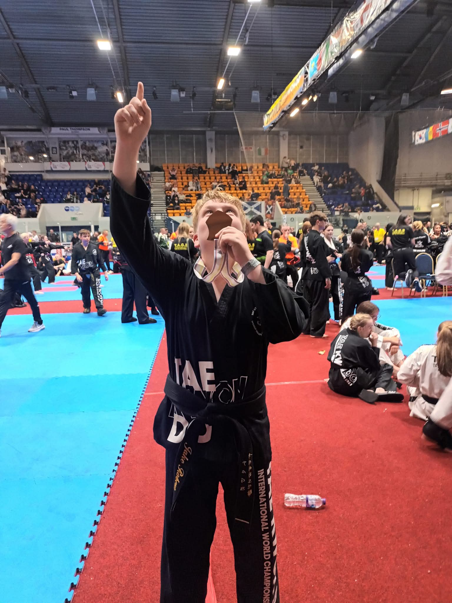 Jake celebrating at the World Championships, pointing to the sky